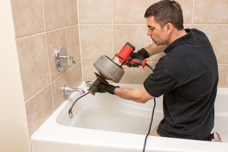 Plumber Working on Bathtub